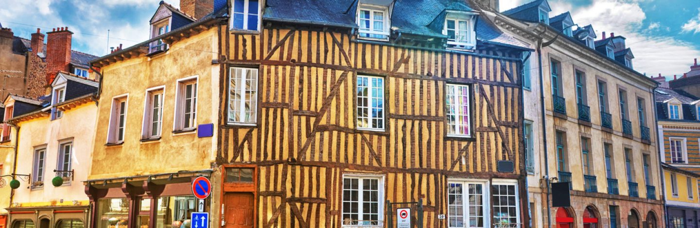 Rennes, France - May 7, 2012: Old half-timbered houses in the old city center of Rennes, Brittany region, France. People on the background.