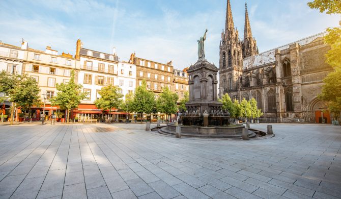 Morning view on the Victory square with monument and cathedral in Clermont-Ferrand city in France