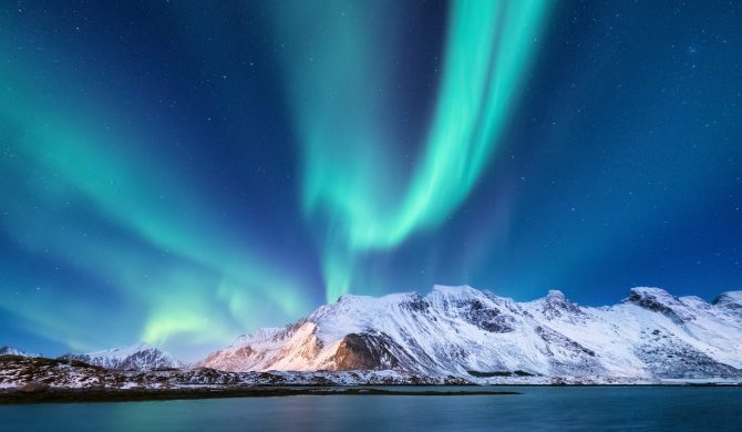 Northen light under mountains. Beautiful natural landscape in the Norway