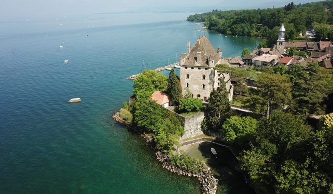 Aerial drone image of Yvoire medieval town and its defensive castle overlooking the Geneva Lake.