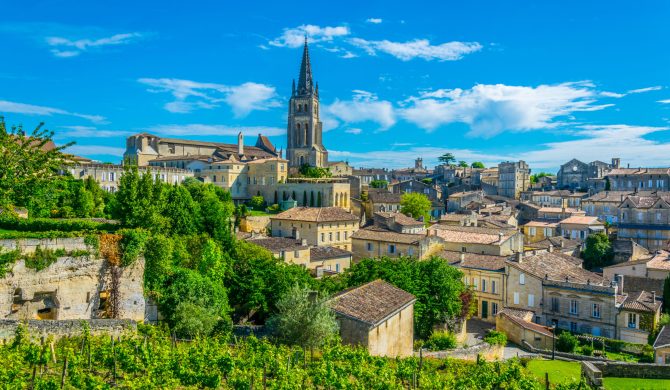 Aerial view of French village Saint Emilion dominated by spire of the monolithic church