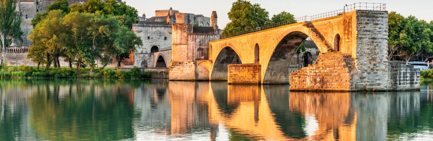 Avignon Bridge with Popes Palace and Rhone River at sunrise, Pont Saint-Benezet, Provence, France.