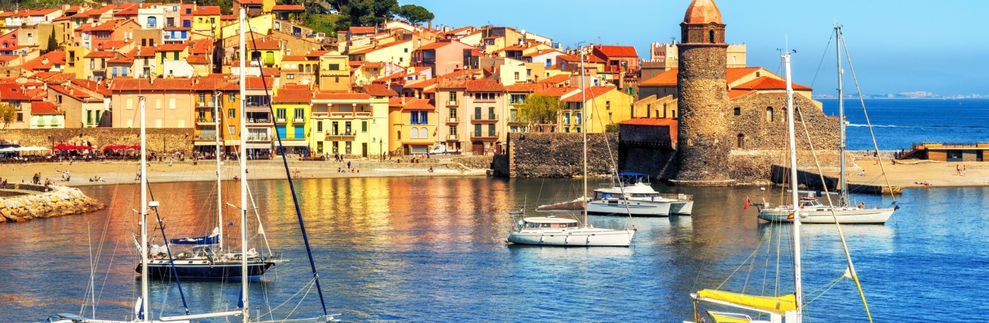 Collioure, France, a popular resort town on Mediterranean sea, view of the Old town with Notre-Dame des Anges church and the harbor