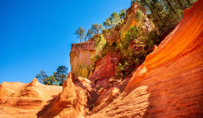 Roussillon, France - June 16, 2019. The Ochre Path le Sentier Les Ocres through the Red Cliffs of Roussillon Les Ocres, a nature park in Vaucluse, Provence, France