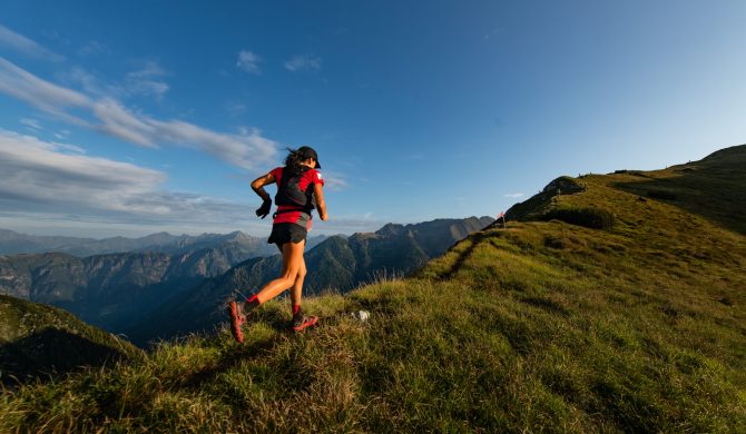 Sporty mountain woman rides in trail during endurance trail