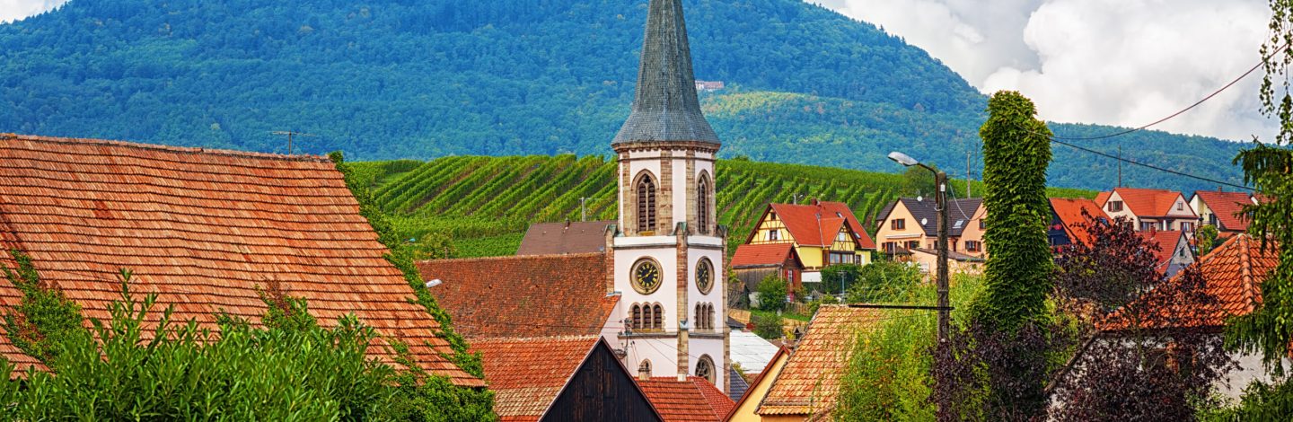 Rorschwihr village on the Alsace Wine Route with Haut Koenigsbourg castle on a hill in background, France