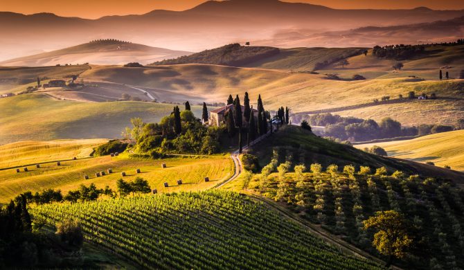 Tuscan morning, a beautiful farmhouse surrounded by the hills of Val d'Orcia