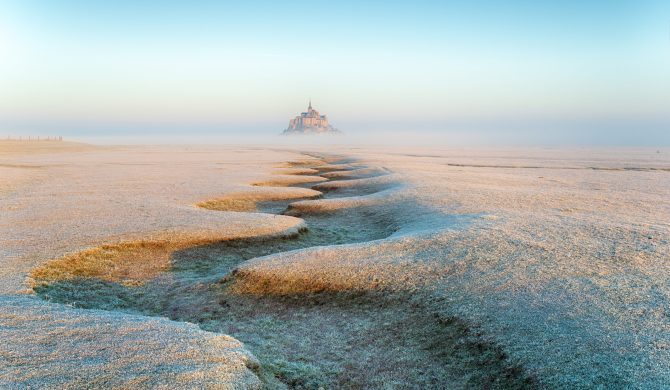 A frosty winters day on the salt marshes overlooking Mont St Michel in France