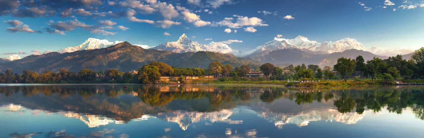 Incredible Himalayas. Panoramic view from the lakeside at the foothills of the magnificent Annapurna mountain range.