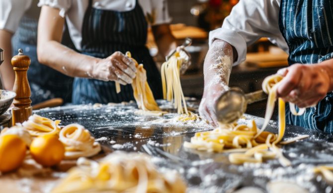 Middle-aged friends actively engage in a pasta-making class. they use pasta machines, mix dough, and cook their pasta creations. an experienced chef provides guidance on techniques and recipes, fostering a hands-on learning environment.